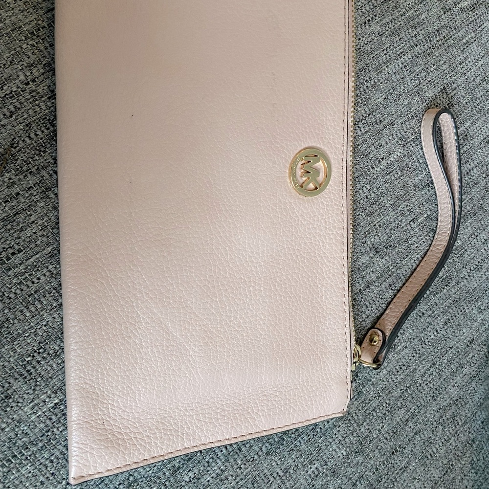 Very nice nude clutch with gold accents!